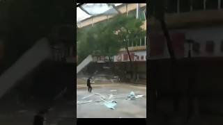 Glass Window Falls on Padestrian in China hurricane flood [upl. by Mellisent]