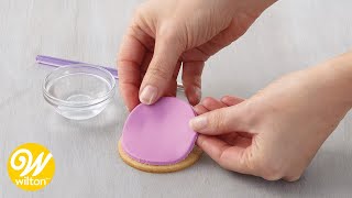 How to Apply Fondant Decorations on Cakes and Other Desserts  Wilton [upl. by Llibyc328]