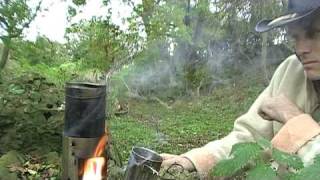 Using a hobo stove with damp sticks [upl. by Emmey]