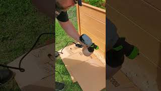 Applying cedar stain to the raised garden beds [upl. by Haret]