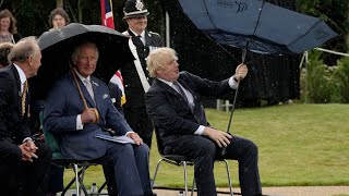 Boris Johnson struggles with umbrella at police memorial unveiling [upl. by Irrol]