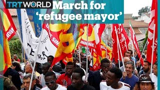 Thousands march in support of Italys refugee mayor [upl. by Barrada]