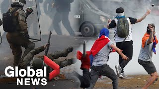 Chile protests Police fire water cannon at protesters as riots continue in Santiago [upl. by Assilaj35]