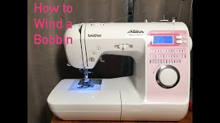 How To Wind a BOBBIN Sewing Machine Brother Project Runway Limited Edition Innovis 40 [upl. by Gusty]