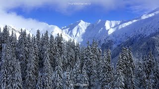 Iarna în Munții României Filmări aeriene 4K cu peisaje spectaculoase de iarnă [upl. by Enitsyrk]