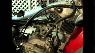 Acerbis 58 gal install XR650L part 1wmv [upl. by Shoifet]