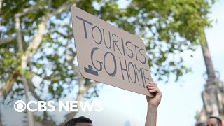 Why Barcelona locals are protesting tourists [upl. by Perceval]