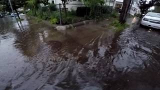 Localized street flooding in Somerville MA 07122017  Clearing the storm drains of debris [upl. by Tatianna]