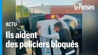 Marseille  des jeunes aident des policiers bloqués dans une voiture retournée [upl. by Yasdnyl336]