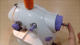 How to use and to wind a bobbin on a portable mini sewing machine with pedal video [upl. by Aivul]