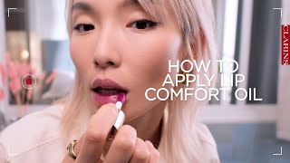 How to apply a lip oil  Clarins [upl. by Trini]