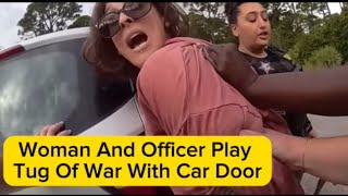 Woman And Officer Play Tug Of War With Car Door [upl. by Dolhenty229]