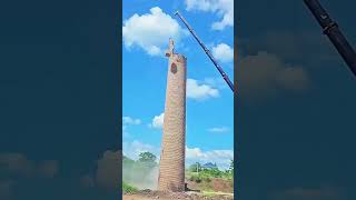 Brick chimney demolishing process with a crane [upl. by Eneri]