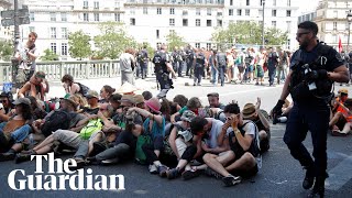 Police use pepper spray on seated climate protesters in Paris [upl. by Aihsilat160]