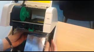 How to change the ribbon on a TEC SA4 thermal transfer printer [upl. by Notfilc]