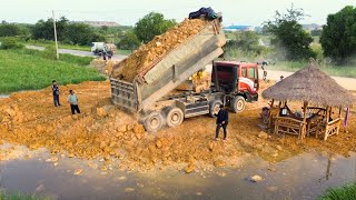 Next Ation Many Dumptrucks Unloading Dirt into pond By Bulldozer Skill Working Nearby Trash Pile In [upl. by Earehs]