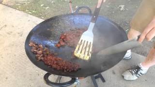 Jesse cooks on the cowboy wok cast iron plow share [upl. by Poll]