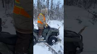 Winching frozen snowmobile with quad [upl. by Ahsiatal506]