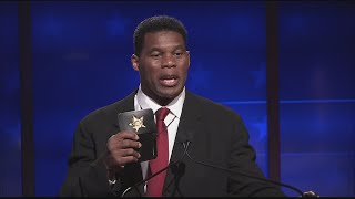 Herschel Walker apparently pulls out badge during debate [upl. by Sicard]