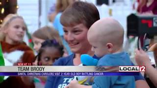 Neighborhood gathers to sing Christmas carols for child with terminal brain cancer [upl. by Teodoor]