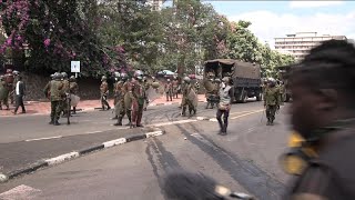 Kenya police antitax protestors clash near parliament debating tax hike bill  AFP [upl. by Ennyletak]