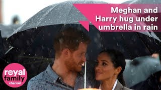 Prince Harry and Meghan hug under umbrella as they bring English weather to droughtstricken Dubbo [upl. by Ferretti]