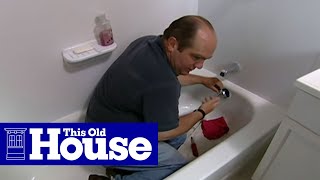 How to Clear a Clogged Bathtub Drain  This Old House [upl. by Ycnan]