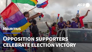 Mauritius opposition supporters celebrate an expected election victory  AFP [upl. by Oilalue]