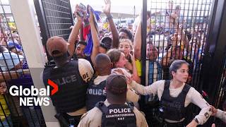 Copa America Ticketless fans climb through air vents over fence in attempt to get in stadium [upl. by Balthazar127]