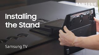 Unpacking and installing your 65” QN900 Samsung TV stand  Samsung US [upl. by Lletnohs]