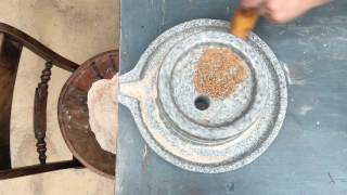 Granite HandMill or Quern Stone Mill Demonstration  grind flour the old way [upl. by Flessel]