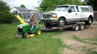 John Deere lawn tractor pulls F350 Dually [upl. by Atlas173]