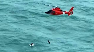 US Coast Guard rescues man clinging to a cool box near Longboat Key following Hurricane Milton  AFP [upl. by Rempe]