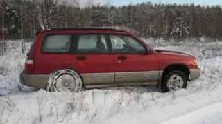 Subaru Forester in snow get two wheels off the ground [upl. by Aihsela]