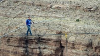 With Dramatic Pauses Daredevil Crosses Grand Canyon on Steel Tightrope [upl. by Enyalaj]