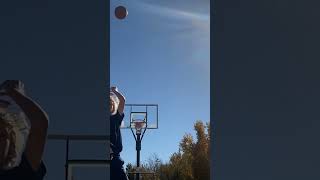 Throwing basketball behind back into hoop trickshot [upl. by Aibos]