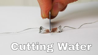 Superhydrophobic Knife Slices Water Drops in Half [upl. by Meerek162]