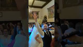 Singing waiter holds the brides wedding train whilst doing the conga [upl. by Airdnal]