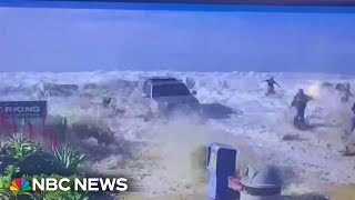 Californians flee from big waves as water breaks over a sea wall [upl. by Parent]