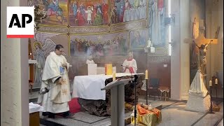 Christian Palestinians attend Christmas Eve mass at Gaza City church [upl. by Lemmueu]