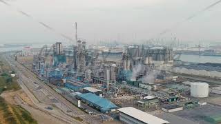 Dolly zoom Antwerp Belgium Port infrastructure with docks and factories Morning hours Aerial Vi [upl. by Plunkett]