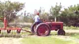 42 Farmall H raking hay [upl. by Acinod]