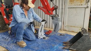 92 Installing BXpanded Quick On Root Ripper Trenching Bucket For Massey Backhoes CB65 75 and 85 [upl. by Aztiley]