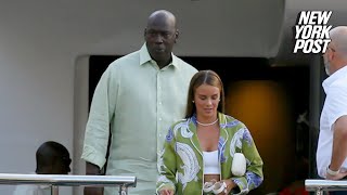 Michael Jordan holds hands with wife Yvette Prieto after leaving his 115 million yacht in Barcelona [upl. by Caprice]