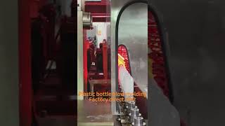 Blow molding machine blows bottles [upl. by Atipul815]