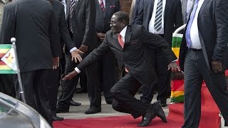 WATCH Robert Mugabe falls down steps in Harare [upl. by Asirem635]