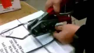 How to Tension Cut and Seal Plastic Strapping  PTIPackagingcom [upl. by Aros]