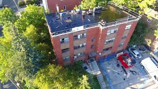 Installing the Soprema Sopralene 180 Base Sheet on this Apartment Building Roof Project [upl. by Itsirhc591]