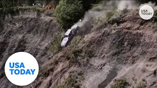 Cars launch off 300foot cliff during Alaska towns annual tradition  USA TODAY [upl. by Zina]