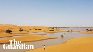 Drone footage shows rare flooding in the Sahara desert [upl. by Berkman]